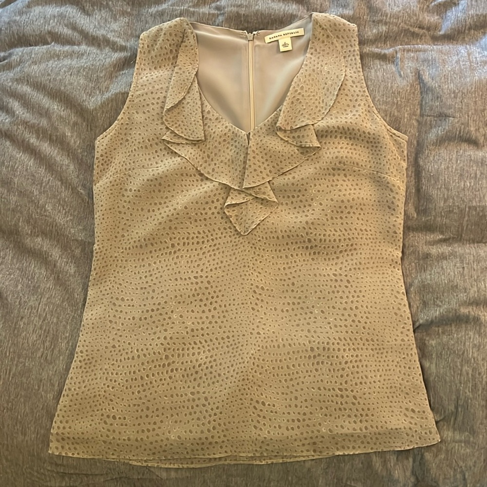 Sleeveless, lined top with nice detail around the neck